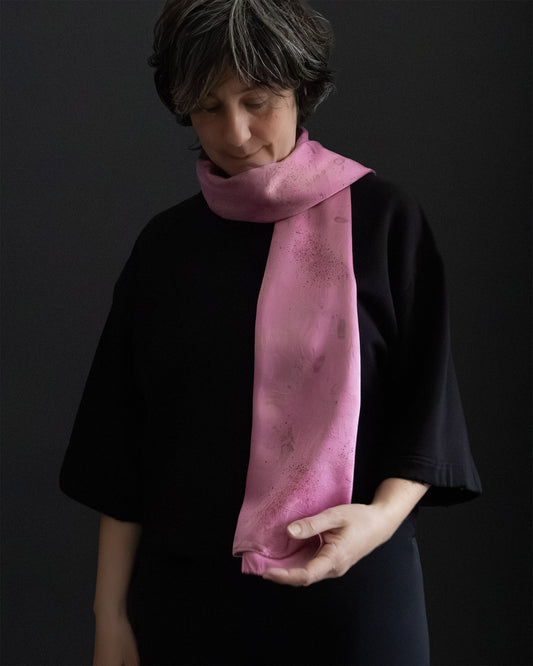 naturally dyed silk scarf worn around the neck, soft drape