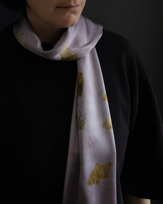 naturally dyed silk scarf with botanical prints, worn