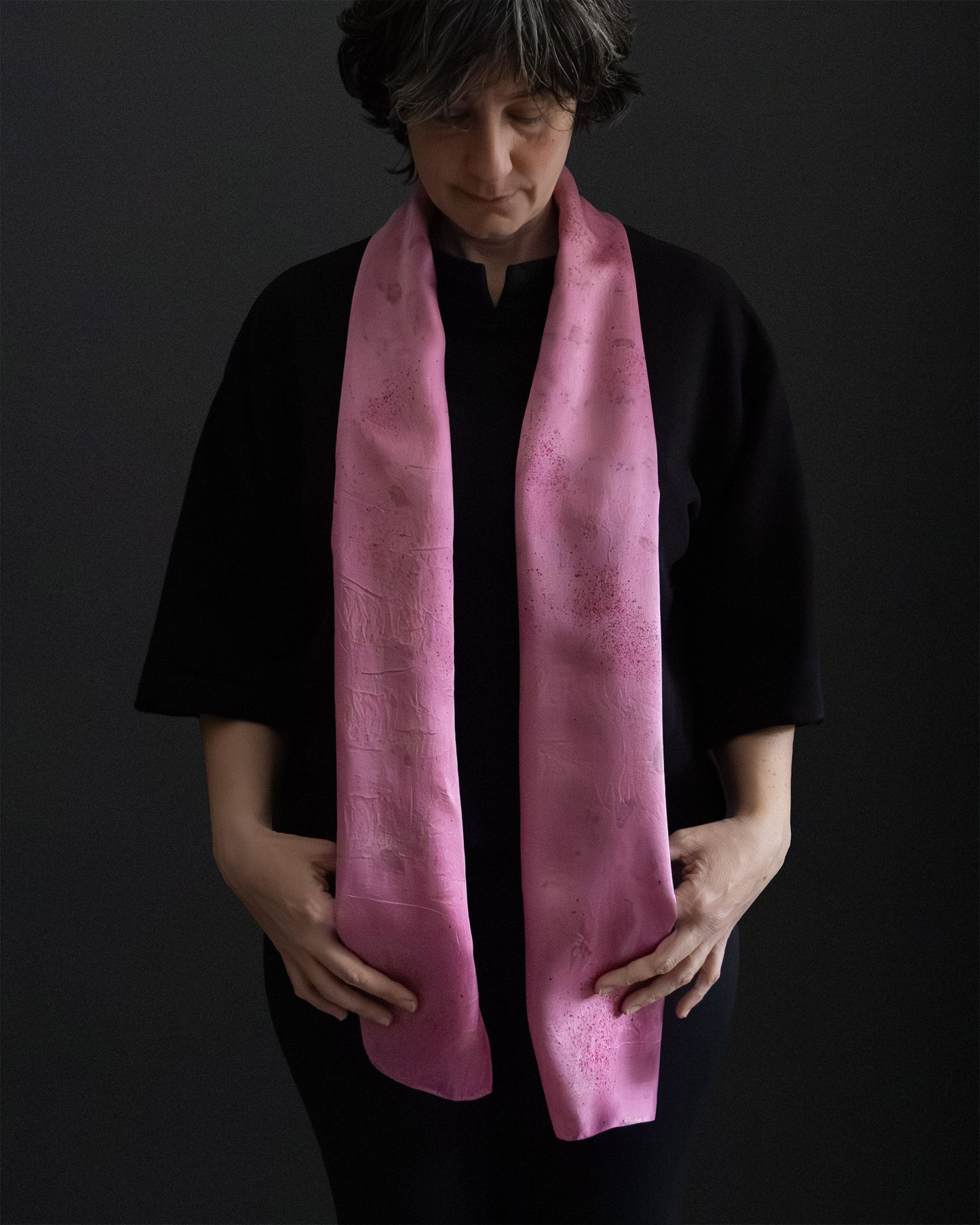 long silk scarf naturally dyed with cochineal, worn front view