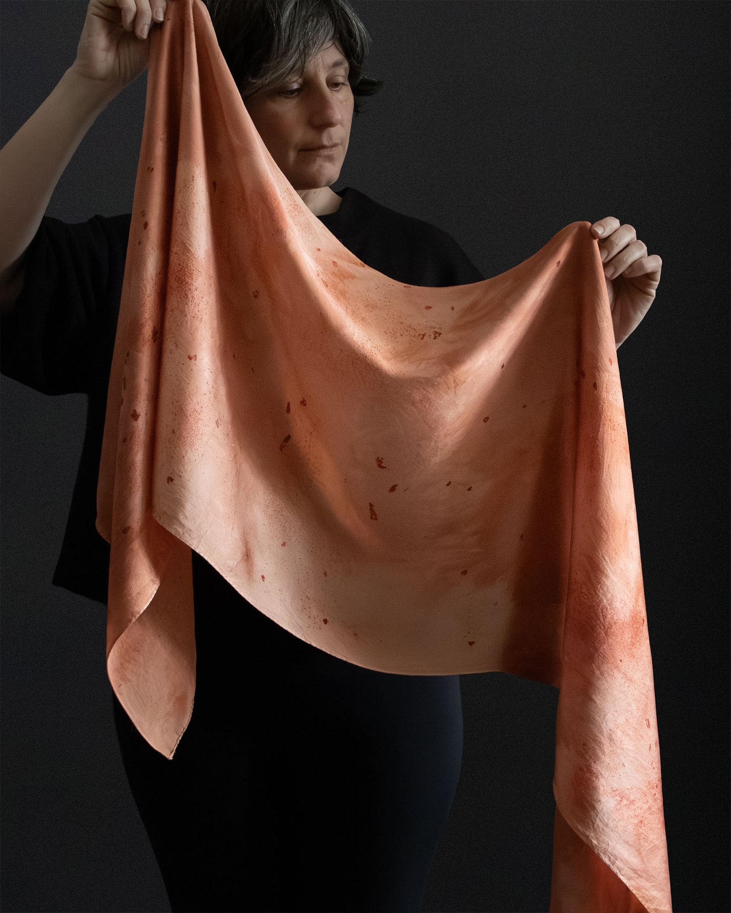 naturally dyed silk scarf held open, madder root dye
