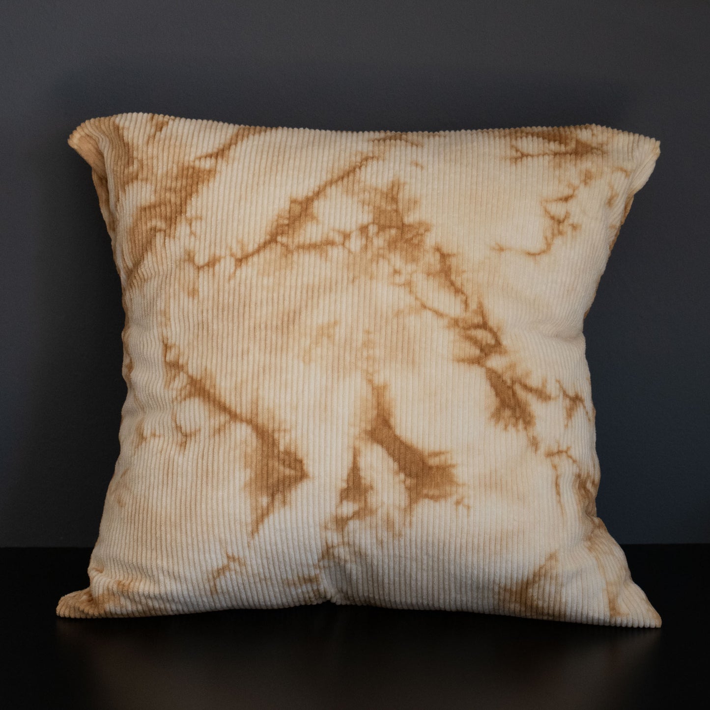 Full view of handcrafted corduroy cushion cover dyed naturally with oak bark in beige and brown.